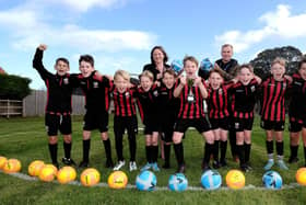 East Ayton Football Champions with Head Lisa Nellist and Teacher Josh Lowe pic Richard Ponter