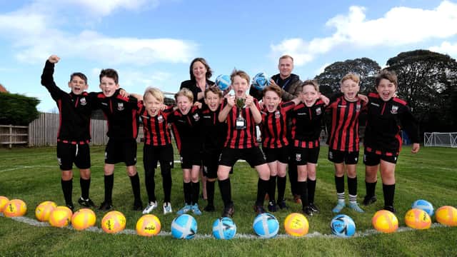 East Ayton Football Champions with Head Lisa Nellist and Teacher Josh Lowe pic Richard Ponter