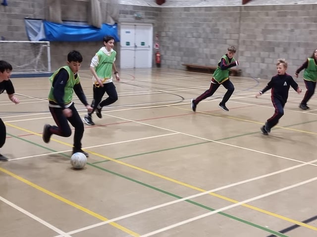 Fyling Hall indoor football action.