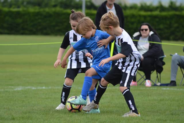 Heslerton Hawks Under-7s, blue kit, playing against Osbaldwick earlier this season.