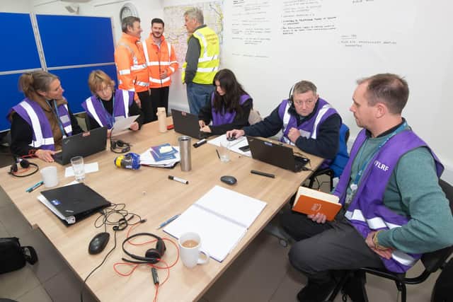 North Yorkshire Council’s executive member for managing our environment, Cllr Greg White, left, and the authority’s executive member for highways and transportation, Cllr Keane Duncan, right, with council staff and volunteers at the local assistance centre in the Moorside Room in Kirkbymoorside.