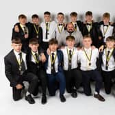 The Hawkes 360 AFC Under-16s line up with their medals at the black tie event at The Ocean Room at Scarborough Spa.