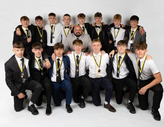 The Hawkes 360 AFC Under-16s line up with their medals at the black tie event at The Ocean Room at Scarborough Spa.