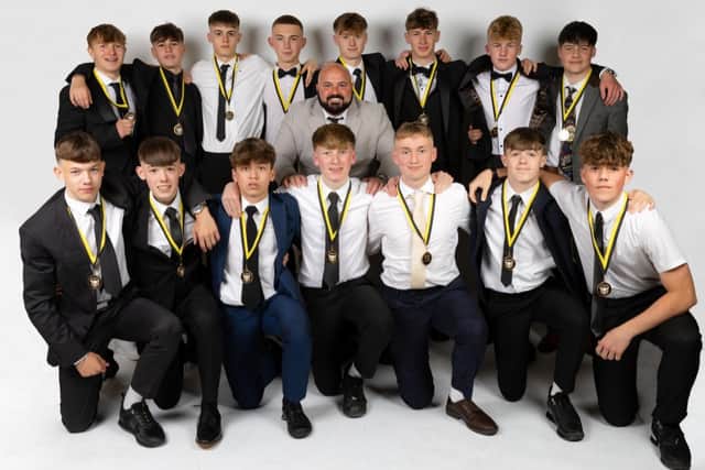 The Hawkes 360 AFC Under-16s line up with their medals at the black tie event at The Ocean Room at Scarborough Spa.