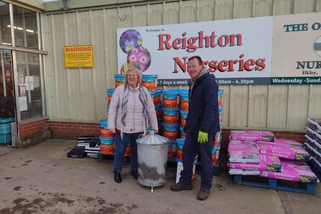Bempton's Lisa Crozier receiving the incinerator from Andy Simmonds from Reighton Nurseries.