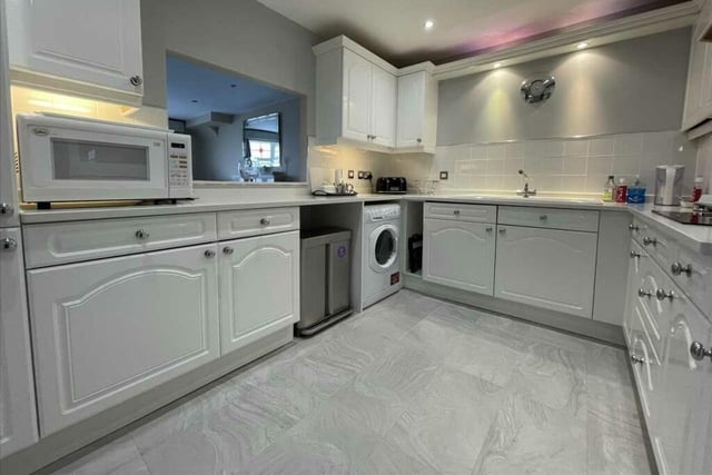 The fitted kitchen with serving hatch has views over Filey Bay.