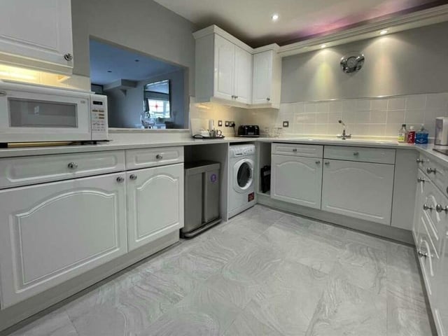 The fitted kitchen with serving hatch has views over Filey Bay.