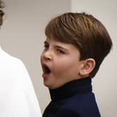 Britain's Prince Louis of Wales yawns as he arrives at Westminster Abbey.