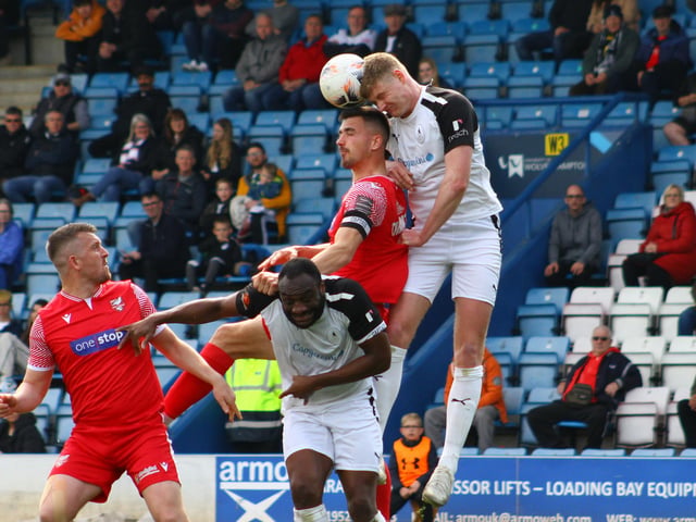 Boro skipper Will Thornton challenges for a header.