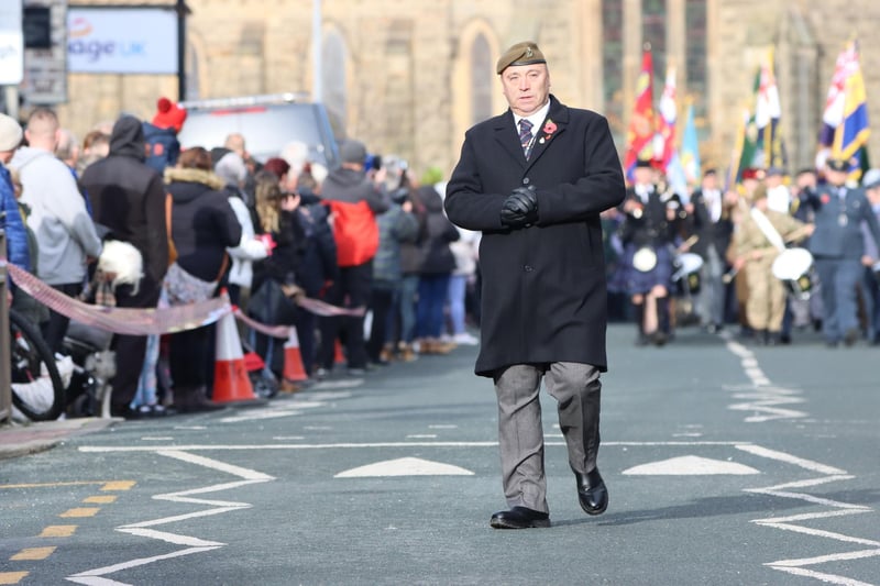 A sombre moment as the parade approaches.