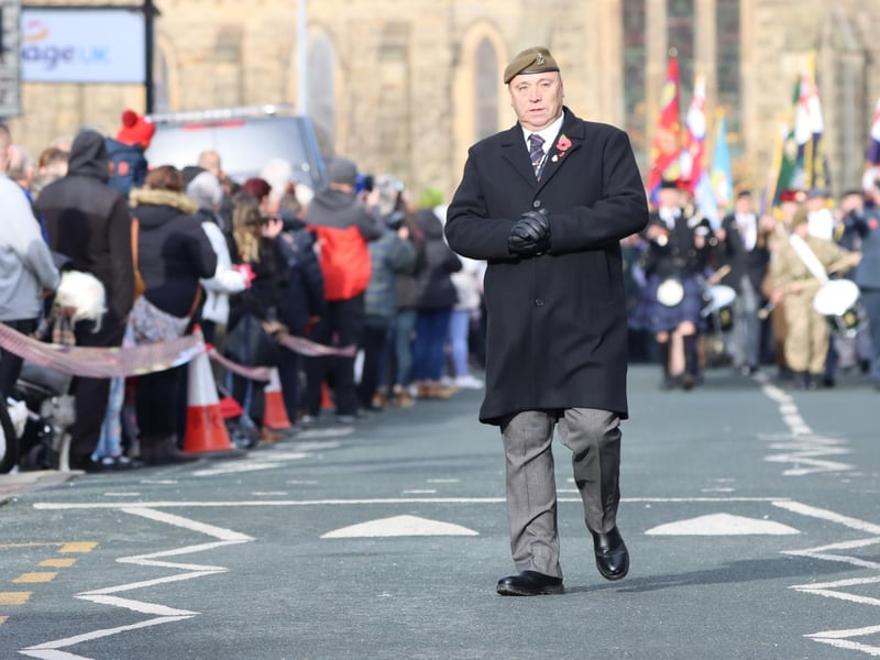 A sombre moment as the parade approaches.