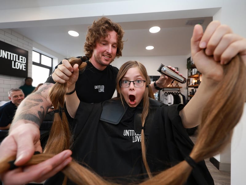 Aaron Gill prepares for his special charity haircut with hairdresser Ethan Pashby