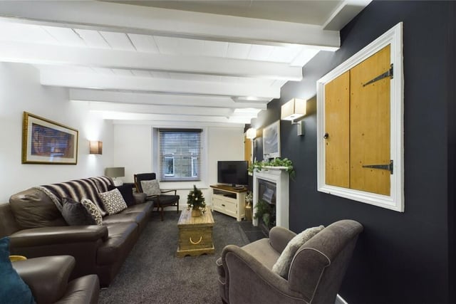 The lounge, with painted ceiling beams.
