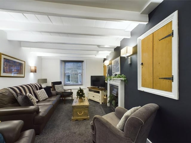The lounge, with painted ceiling beams.