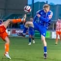 Liversedge's Connor Smythe with Whitby Town's Harry Green