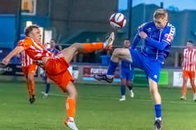 Liversedge's Connor Smythe with Whitby Town's Harry Green