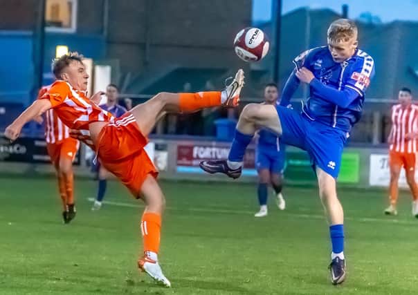Liversedge's Connor Smythe with Whitby Town's Harry Green