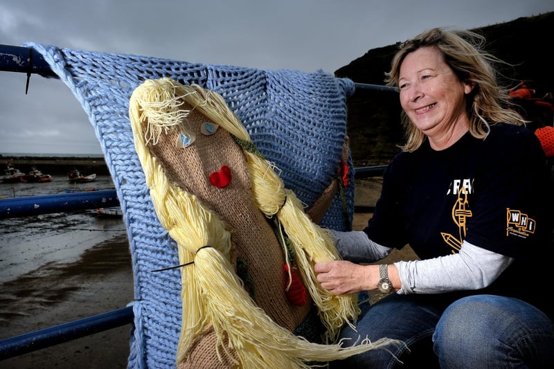 The Staithes Arts and Heritage Festival is on September 14 and 15.
Jacqueline Power arranges the knitted mermaid on the seafront.