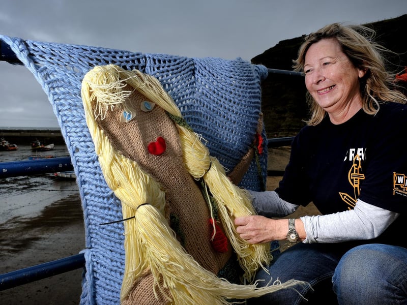 The Staithes Arts and Heritage Festival is on September 14 and 15.
Jacqueline Power arranges the knitted mermaid on the seafront.