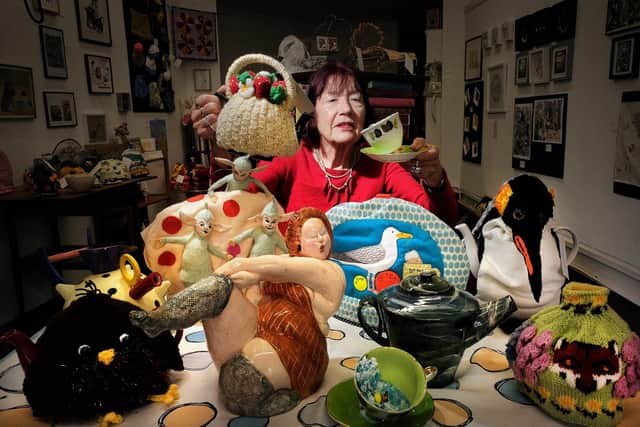 Artist Angela Knipe amongst some of the exhibits