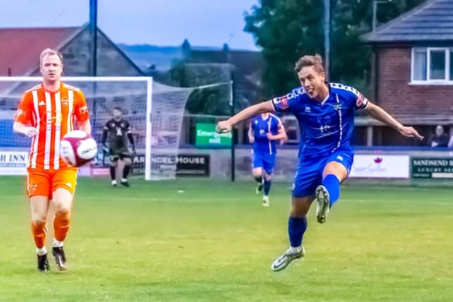 Whitby Town's Jake Hackett fires at the Liversedge goal