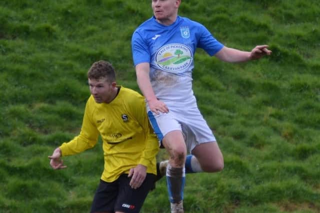 Heslerton's Man of the Match Ben Flinton in full flight during his side's defeat to Goldsborough