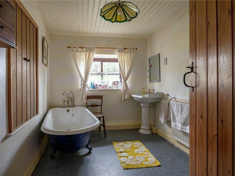 A free standing bath within the bathroom suite.