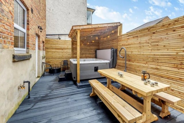 The yard garden has space for a hot tub, and a pergola.
