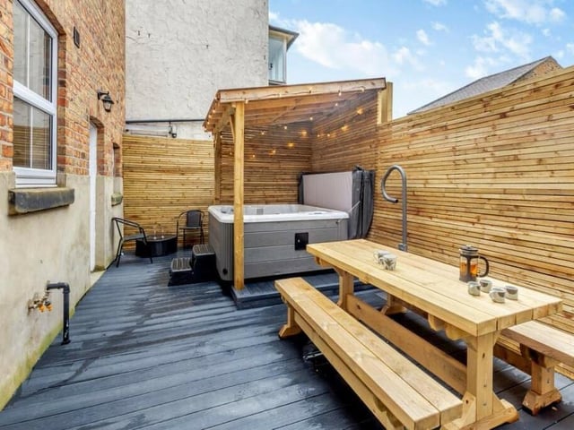 The yard garden has space for a hot tub, and a pergola.