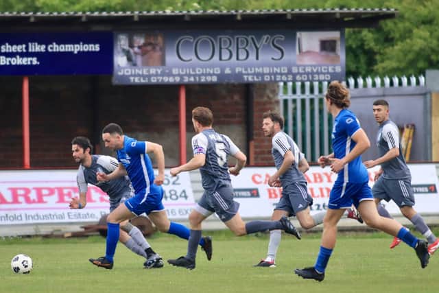 Bridlington Rovers Millau (grey kit) take on North Cave in the East Riding FA Senior Country cup final at Queensgate. Photo by TCF Photography