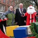 Rotarian Godfrey Allanson,  President of the Rotary Club of Scarborough Trevor Bull, Santa and The Charter Mayor of Scarborough, John Richie.