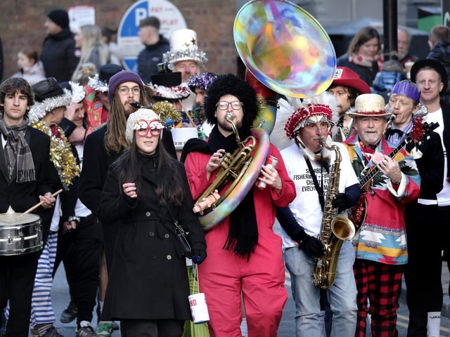 The Comic Band lead players to the beach