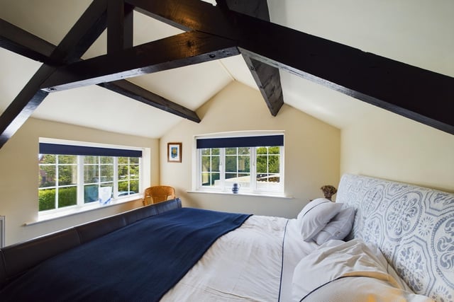 Another of the bedrooms, with open vaulted ceiling.