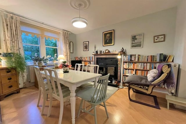 The well-lit dining room displays a traditional range.