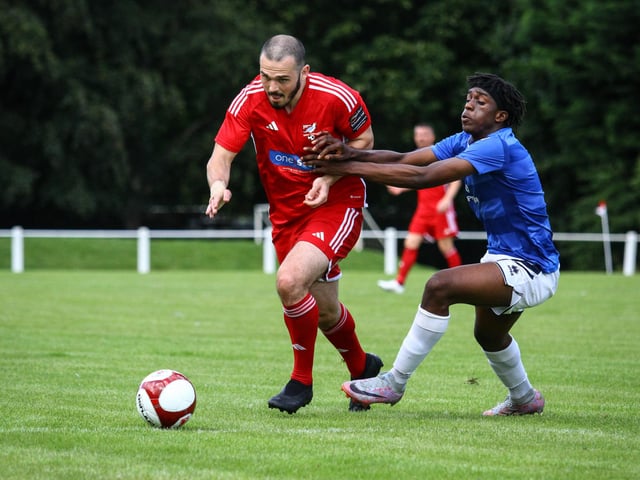 A Marske player gets to grips with Frank Mulhern.
