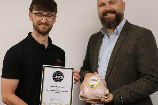 Robert Laird and Dmitrijus Solovjovas with one of the award certificates and an award-winning chicken.