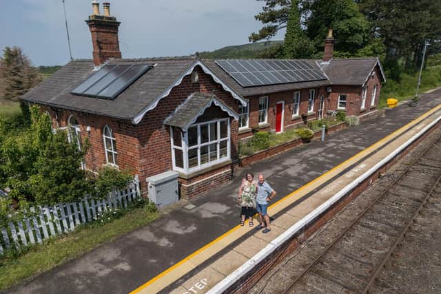 Tim Hill, and Elenor Hill at their home, a converted train station that is sat on a live train line with trains pulling up daily at Battersby Station.