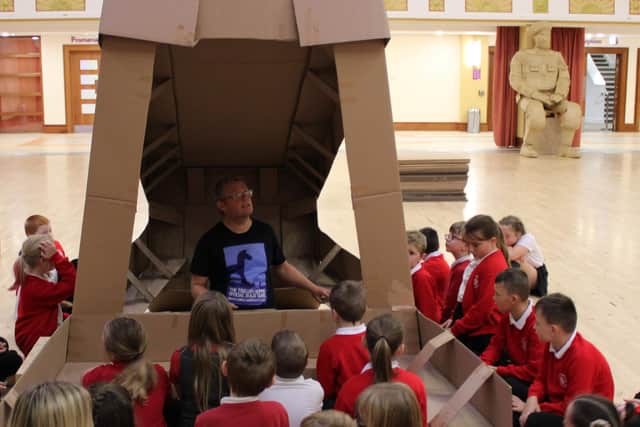 Children from New Pasture Lane School crowded around the head of the Trojan Horse structure.