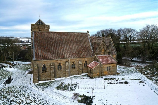A view of the neighbouring church with countryside beyond.