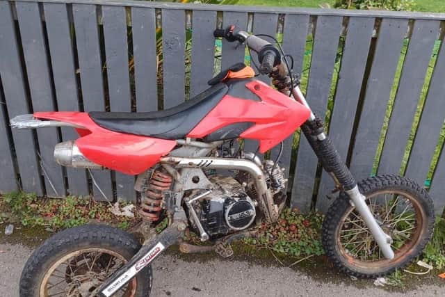 A red off-road motorcycle was located on Caymer Road.