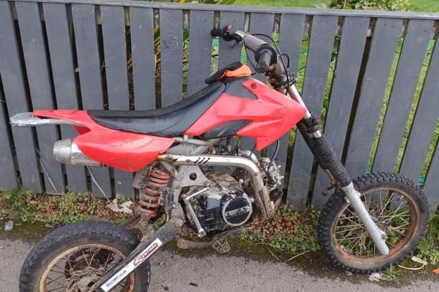 A red off-road motorcycle was located on Caymer Road.