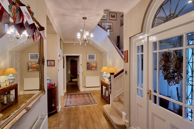 The entrance hallway, with staircase up to a gallery landing.