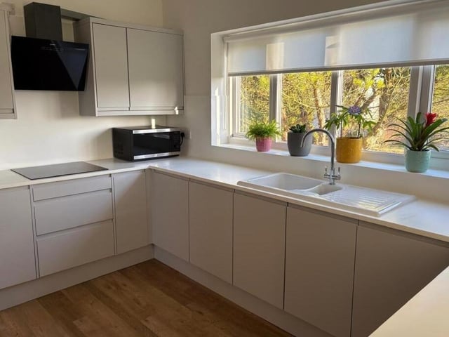 A modern kitchen with plenty of natural light.