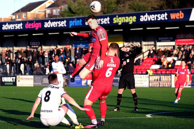 Scarborough Athletic's Dom Tear wins a header against Fylde