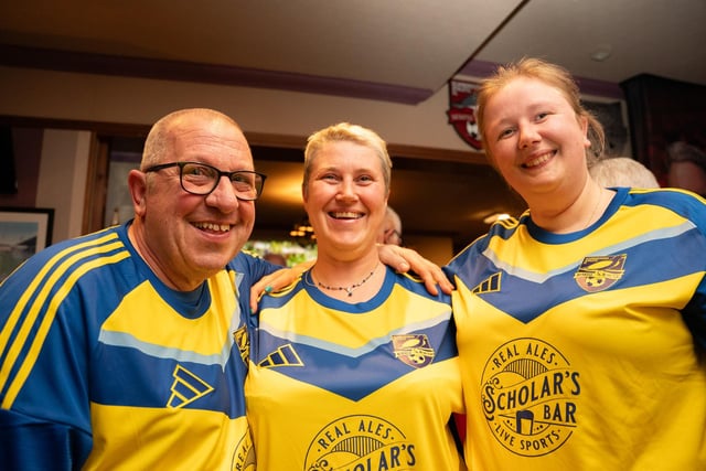 A trio of Scarborough Athletic fans sporting their new away shirts.