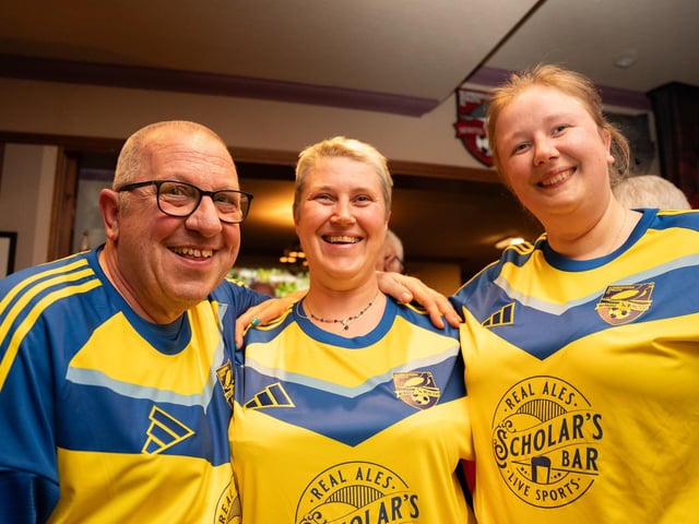 A trio of Scarborough Athletic fans sporting their new away shirts.