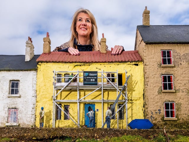 Rachel Hill inspects the progress of the mini workmen.