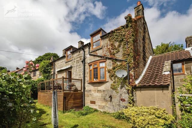 The attractive exterior of the village cottage.