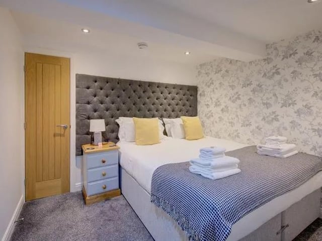 Cosy bedroom at the apartment, which is on the market with Hendersons.