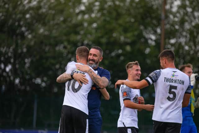 Scarborough Athletic boss Jono Greening celebrates the win at Farsley earlier this season with his players (Photo by Matthew Appleby)